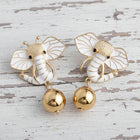Close-up of lightweight gold elephant earrings featuring a cute animal silhouette and minimalist luxury styling.