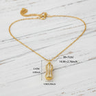 Close-up of a gold peanut pendant necklace featuring two luminous ivory pearls and sparkling moissanite accents on a fine gold chain