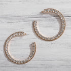Oversized gold crystal hoop earrings with double rows of sparkling rhinestones, luxury statement bridal jewelry for weddings and evening wear.