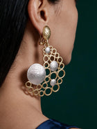 Model wearing oversized 18K gold plated bubble statement earrings featuring an open geometric circle design with textured Gold and silver-tone accents