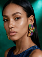 Close-up side profile showing lightweight purple, green, and gold sculptural ruffle earrings with bold geometric design and luxurious gold detailing.