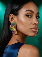 Luxury Mardi Gras statement earrings styled with an emerald green outfit, featuring bold purple, green, and gold geometric ruffle shapes perfect for New Orleans-inspired fashion.