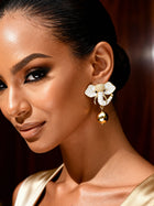 Gold elephant stud earrings with polished 18K gold finish and playful mini statement design for everyday wear.